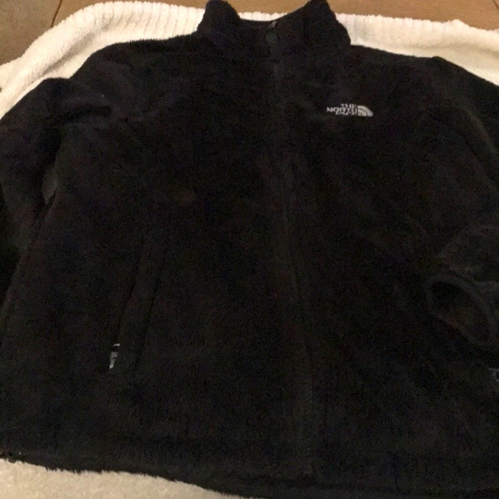 The North Face jacket. Pockets, zipper all the way up.